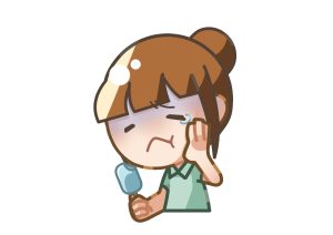 冷たい物を食べて歯がしみている女性のイラスト